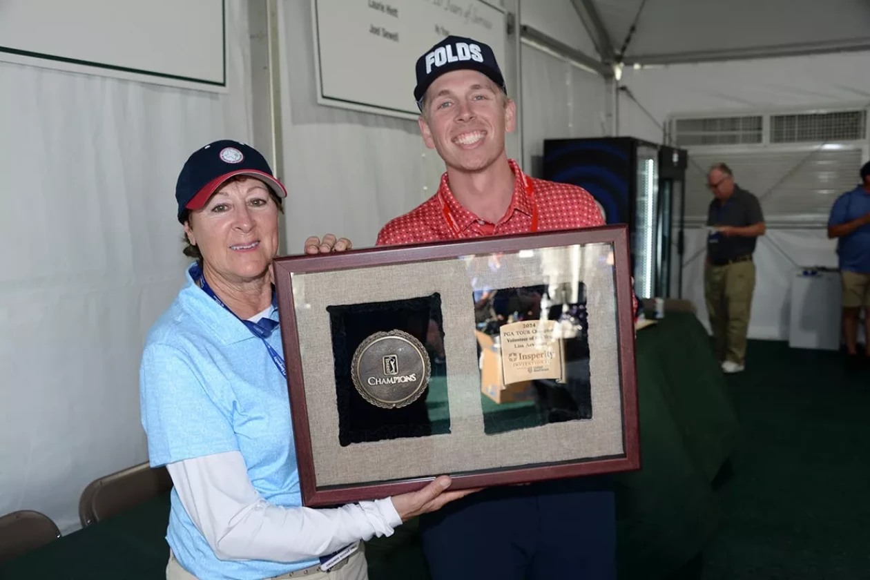 Photo of Lisa Arvidson accepting the 2024 PGA TOUR Champions Volunteer of the Year
